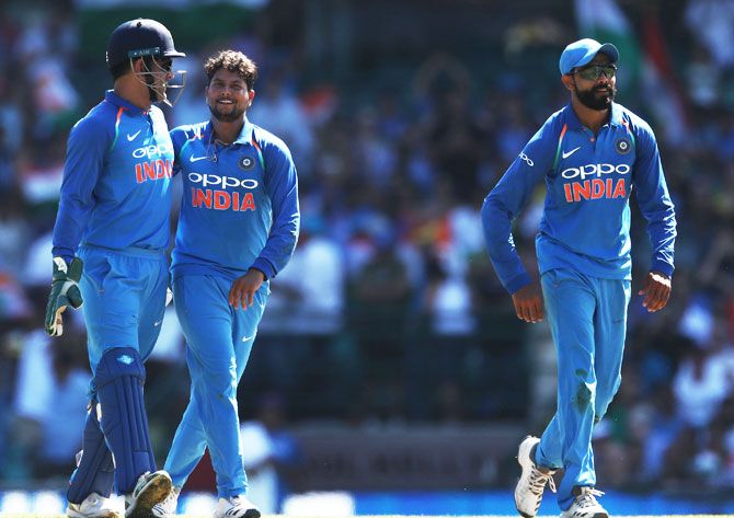 India's Kuldeep Yadav celebrates with MS Dhoni after dismissing Australia's Shaun Marsh 