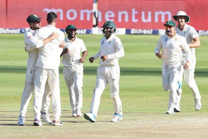 South Africa's Duanne Olivier and Aiden Markram celebrate the wicket of Pakistan's Azhar Ali on Day 3 of the 3rd Test match at Bidvest Wanderers Stadium in Johannesburg on Sunday