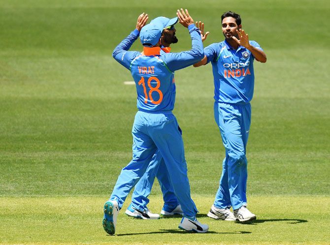 Indian players celebrate after Bhuvneshwar Kumar gets the wicket of Aaron Finch