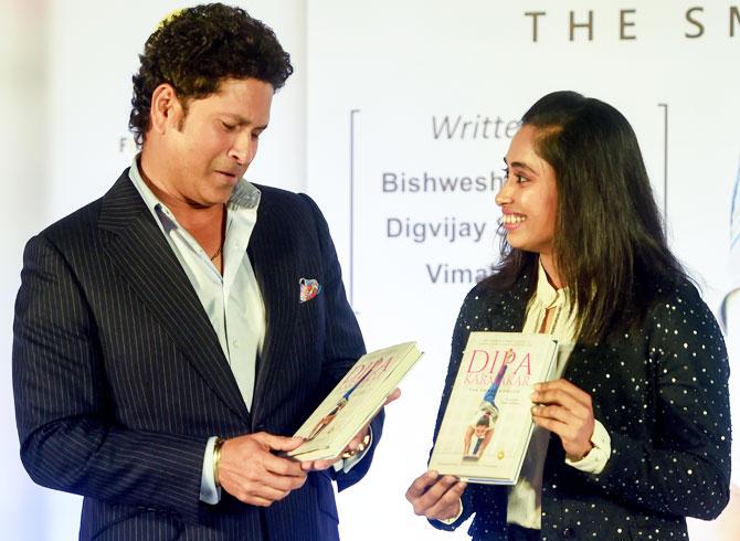 Former India cricketer Sachin Tendulkar and gymnast Dipa Karmakar unveil a biography 'Dipa Karmakar: The Small Wonder' at the Mumbai book launch on Tuesday