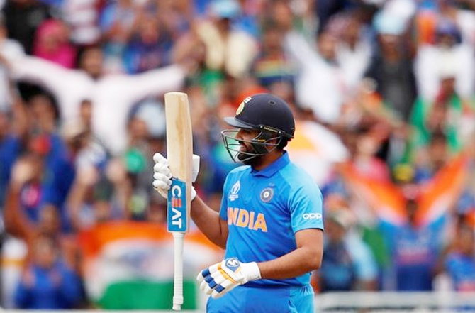 Rohit Sharma celebrates scoring a hundred against Bangladesh in the World Cup
