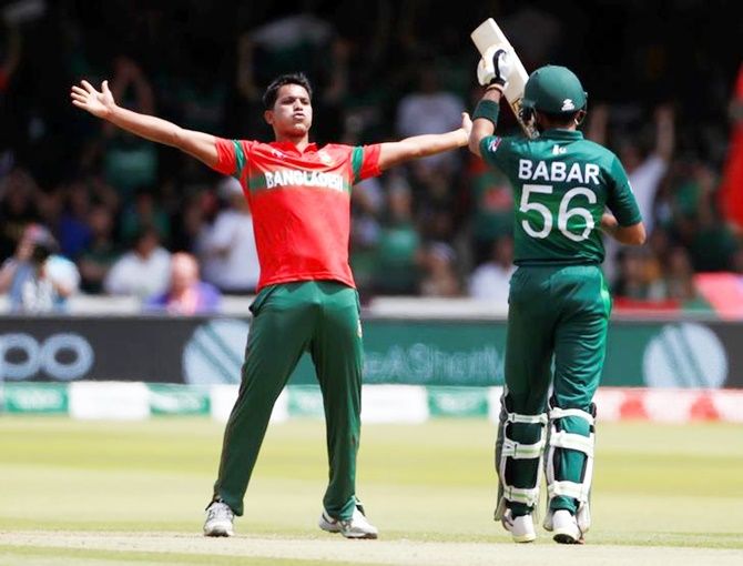 Mohammad Saifuddin, who fininshed with a four-wicket haul, celebrates taking the wicket of Babar Azam.