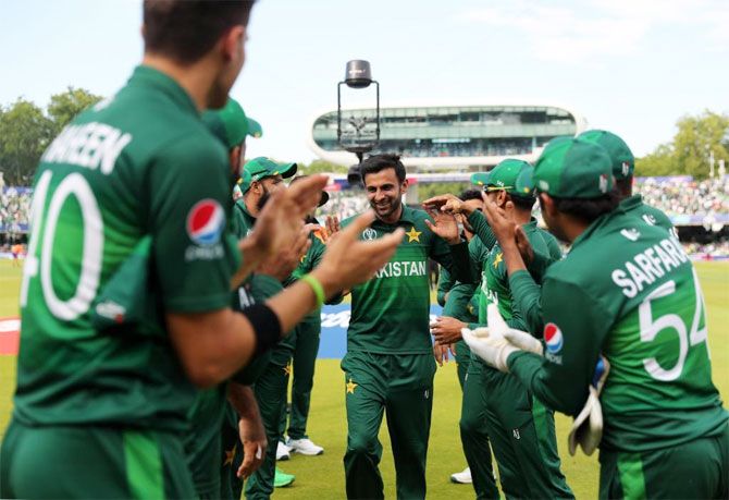 Shoaib Malik is greeted by his teammates after the match against Bangladesh on Friday