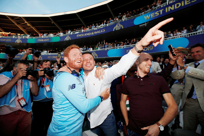 England's Jonny Bairstow celebrates with a fan in the stands 