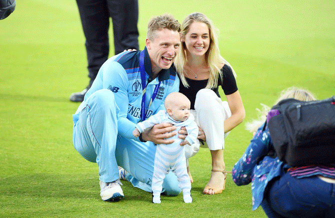 England's Jos Buttler poses for a photo with his family