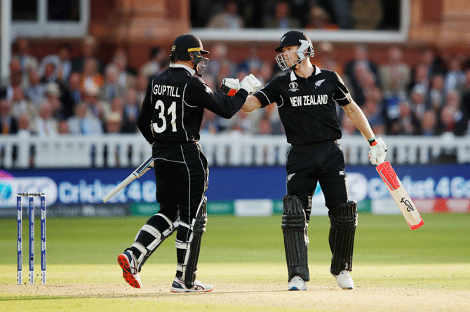 Jimmy Neesham and Matin Guptill pump fists after the former hit a six in the Super Over