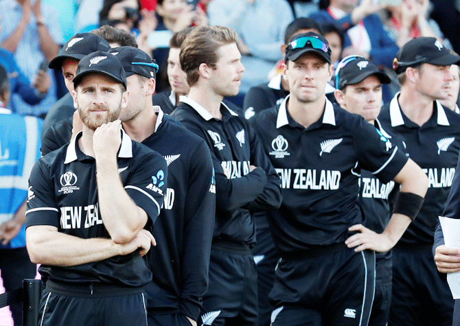 vNew Zealand's Kane Williamson and teammates wear a dejected look after the World Cup final