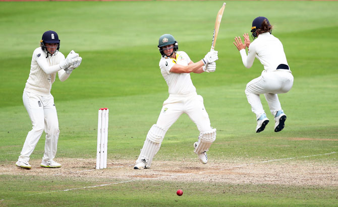 Australia's Ellyse Perry in action as England's Sarah Taylor looks on during the Women’s Ashes Test Match at The Coopers Associates County Ground, Taunton, on Sunday. Perry was again the pick of the Australian batters, following up her first innings 116 with an unbeaten 76 in the second.