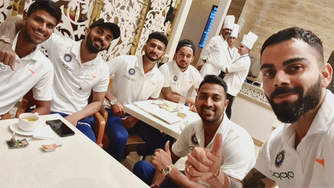 Indian captain Virat Kohli (right with teammates before flying off to Florida for the T20s against West Indies