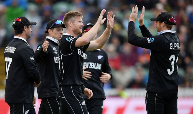 New Zealand's Jimmy Neesham celebrates with his teammates after taking the wicket of Afghanistan's Najibullah Zadran during their ICC Cricket World Cup 2019 match at The County Ground in Taunton on Saturday