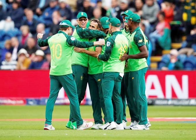 South Africa's players celebrate the fall of a wicket against Afghanistan