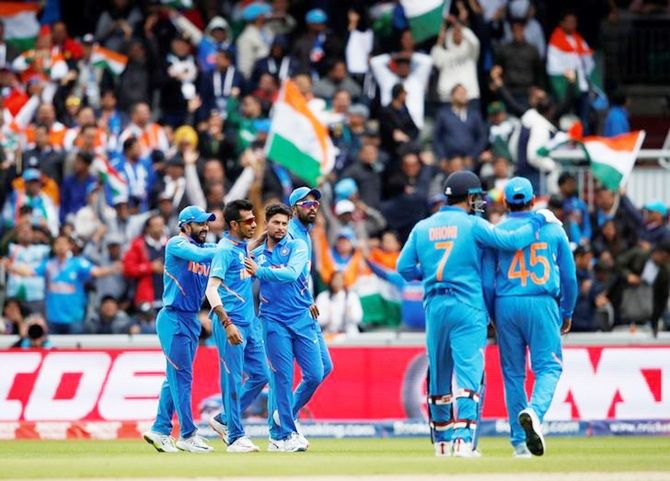 Kuldeep Yadav is congratulated by his India team mates
