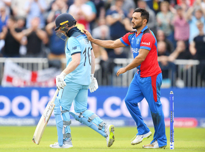 Afghanistan's Gulbadin Naib congratulates England's Eoin Morgan on his innings after dismissing him during their round-robin match of the ICC Cricket World Cup 2019 at Old Trafford in Manchester on Tuesday