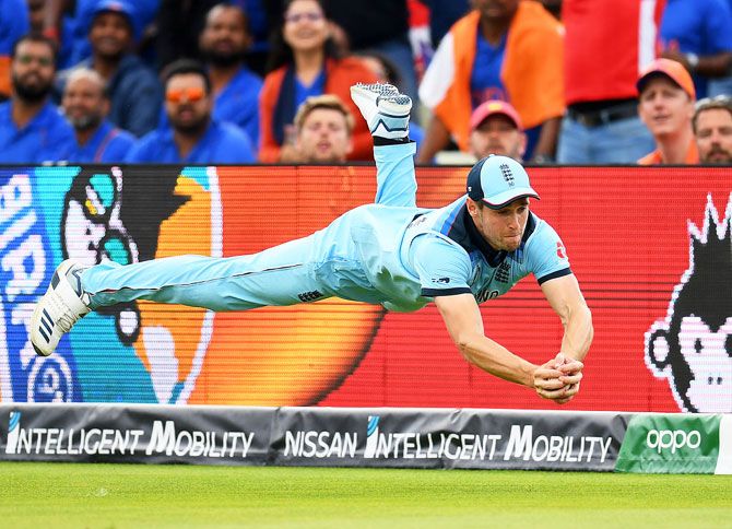 Chris Woakes dives to take a catch to dismiss Rishabh Pant