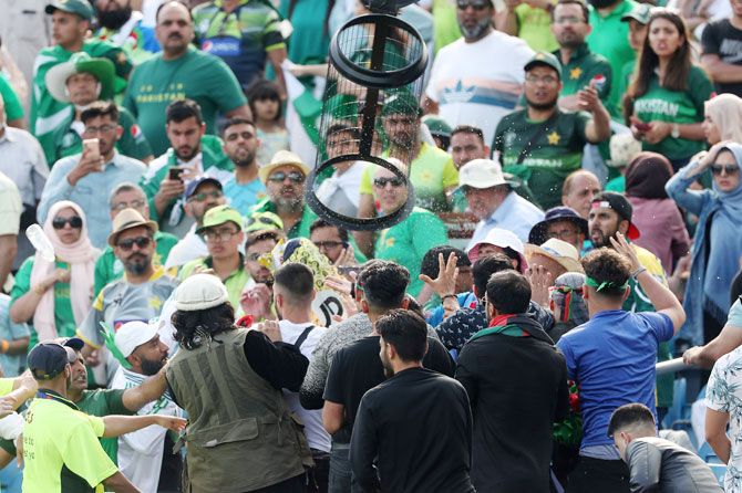Fans clash in the stands during the match against Pakistan and Afghanistan at Headingley, Leeds on Saturday