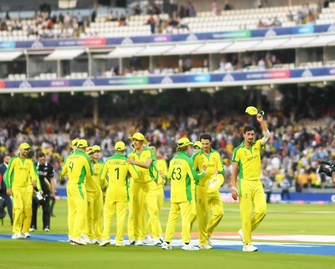 Mitchell Starc leads the Australia team off the field after victory over New Zealand