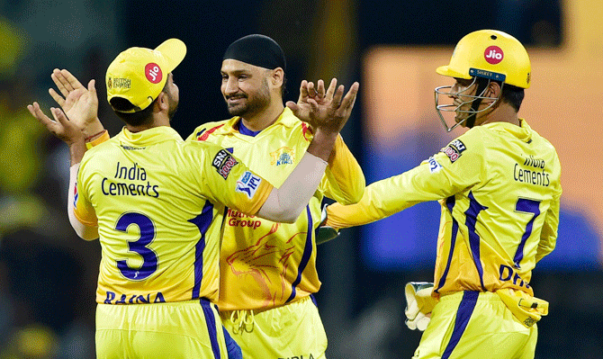 Chennai Super Kings players celebrate with Harbhajan Singh after the dismissal of Royal Challengers Bangalore's Moeen Ali 