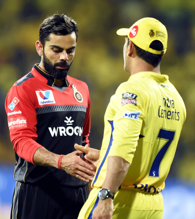  Chennai Super Kings' skipper Mahendra Singh Dhoni is congratulated by Royal Challengers Bangalore captain Virat Kohli at the end of first match of 12th edition of the 2019 Indian Premier League at MAC Stadium in Chennai on Saturday