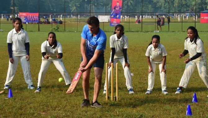 Former Australian cricketer Adam Gilchrist bats during the Cricket Charity Challenge in Mumbai on Wednesday