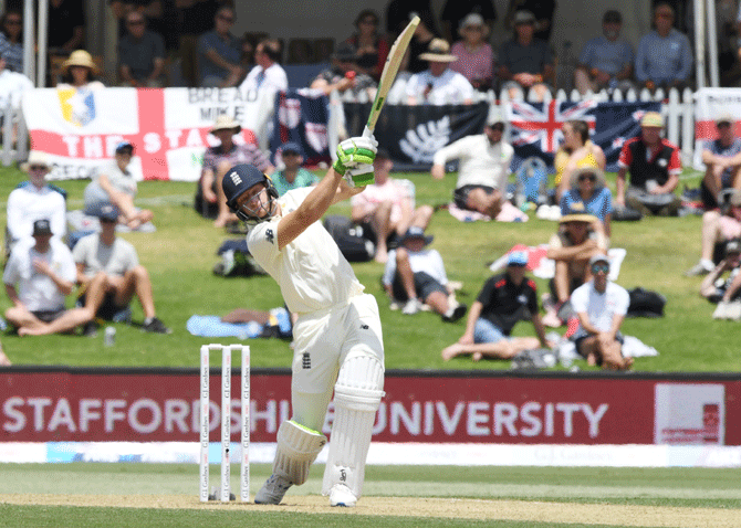 England's Jos Buttler hits a six during his innings of 43