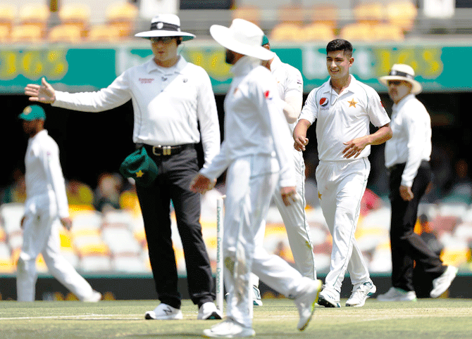 Umpire Richard Kettleborough signals a no ball after Pakistan's Naseem Shah oversteps. Shah had originally claimed the wicket of David Warner, having him caught behind