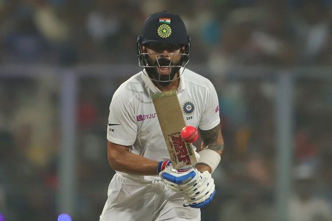 India's captain Virat Kohli reacts after negotiating a delivery on Day 1 of the second Test against Bangladesh, at the Eden Gardens, in Kolkata.