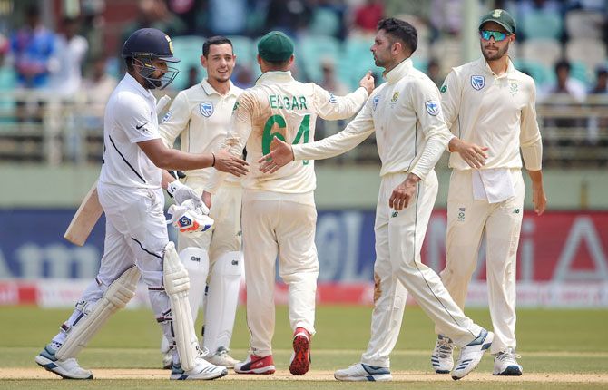 South African players celebrate the dismissal of India's Rohit Sharma on Day 2 of the 1st cricket Test match at Dr YS Rajasekhara Reddy ACA-VDCA Cricket Stadium, in Visakhapatnam, on Thursday