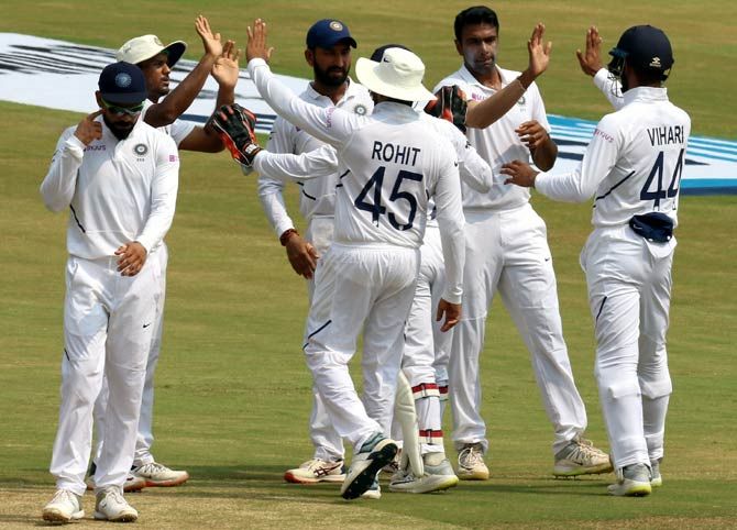 India's players celebrate after Ravichandran Ashwin dismisses Kehav Maharaj