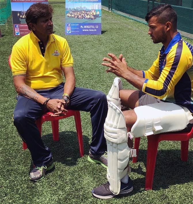Mayank Agarwal with his coach RX Murali