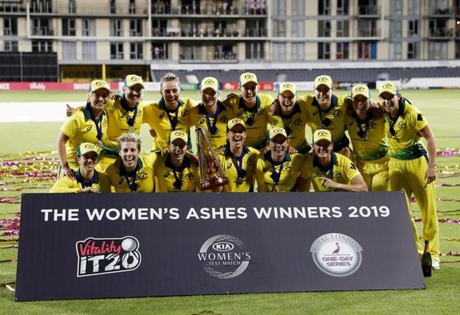 Australia players celebrate with the trophy after winning the women’s Ashes