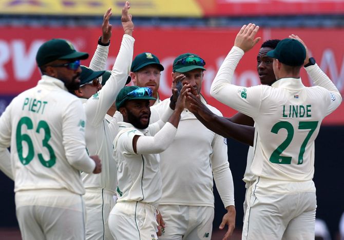 South Africa's players celebrate the dismissal of Cheteshwar Pujara