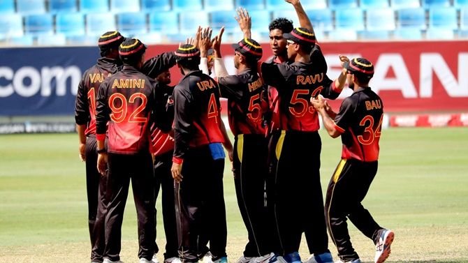 Papua New Guinea players celebrate defeating Kenya in the World T20 qualifier in Dubai on Sunday. 