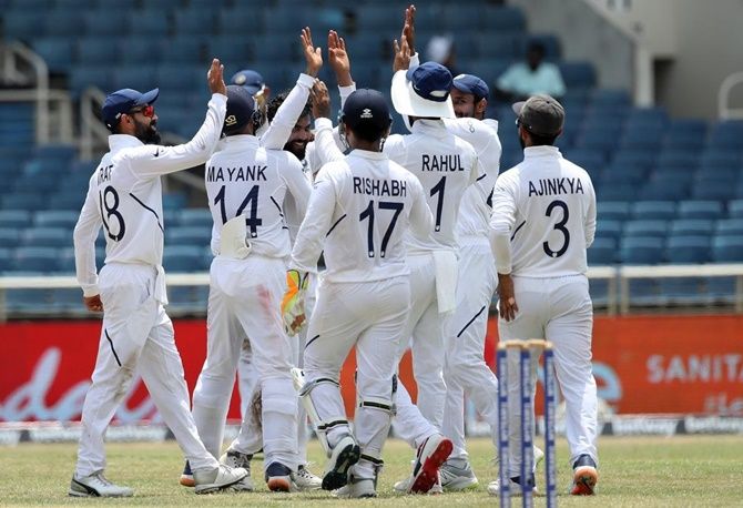 India players celebrate the dismissal of Jahmar Hamilton