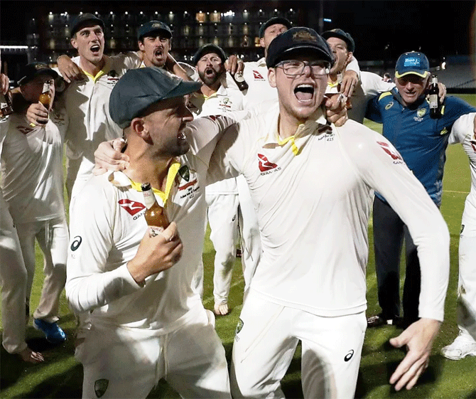 A bespectacled Steve Smith celebrated with teammates after the Aussies retained the Ashes by winning the 4th Ashes Test last week