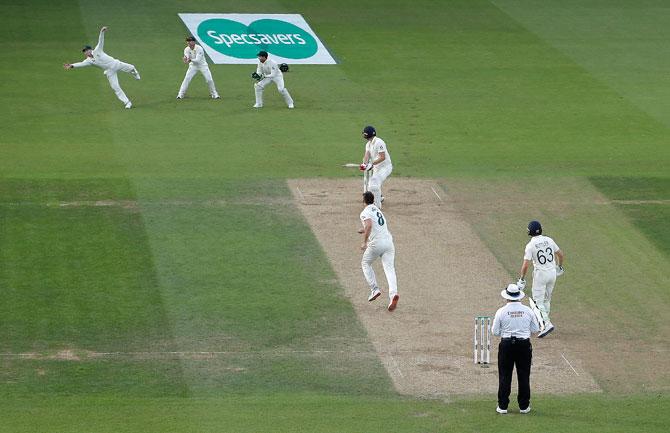 Steve Smith takes a catch to dismiss Chris Woakes