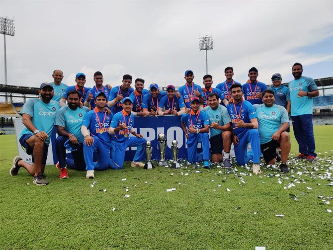 The India under-19 team celebrate with the trophy on winning the under-19 Asia Cup on Saturday
