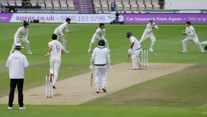 England's Joe Root catches out Pakistan's Asad Shafiq off the bowling of James Anderson 