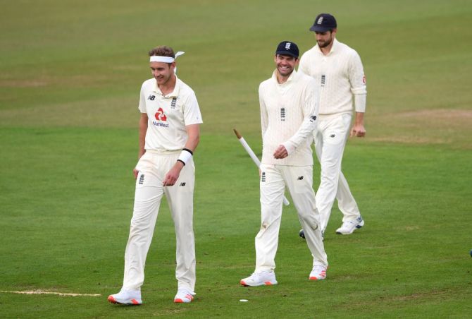 James Anderson (centre) walks off with Stuart Broad and Chris Woakes at close of play after the match was drawn