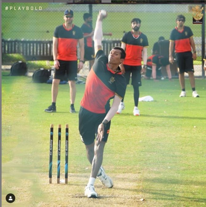 RCB's Navdeep Saini bowls in the nets on Saturday