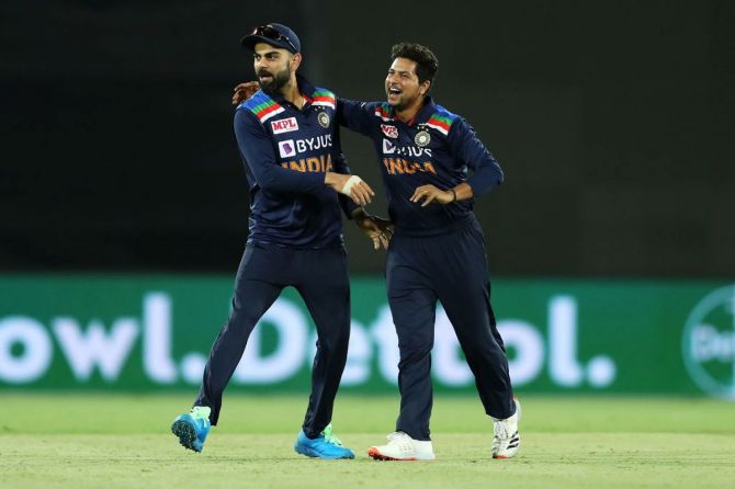 Virat Kohli and Kuldeep Yadav celebrate on dismissing Cameron Green in the 3rd ODI at Manuka Oval in Canberra on Wednesday.