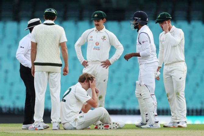 Australia A's Cameron Green reacts after being hit in the head from a shot by India's Jasprit Bumrah on Day 1 of the tour match between Australia A and India at Sydney Cricket Ground in Sydney on Friday
