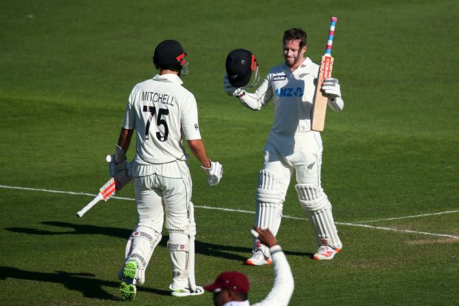New Zealand's Henry Nicholls celebrates his century with Daryl Mitchell on Day 1 of the 2nd Test against West Indies at Basin Reserve in Wellington on Friday