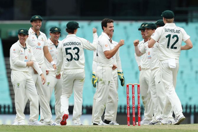 Australia A's Jack Wildermuth celebrates with team mates after claiming the wicket of India's Rishabh Pant