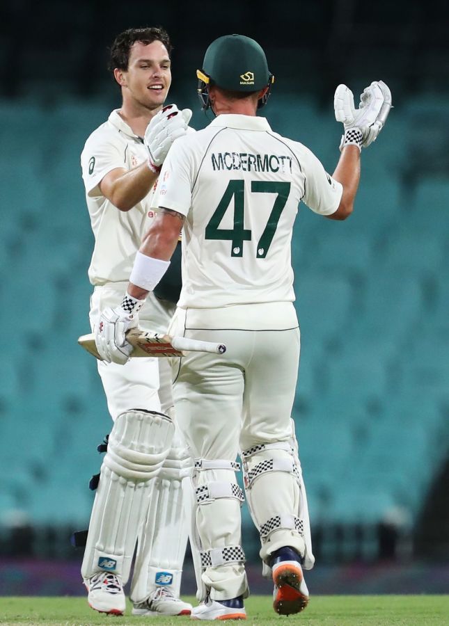Australia A's Jack Wildermuth is congratulated by Ben McDermott on scoring his century 