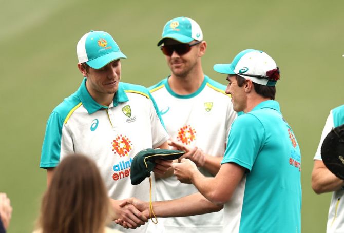Cameron Green receives his Baggy Green Cap from Pat Cummins on Day 1 of the first Test between Australia and India at the Adelaide Oval on Thursday. 