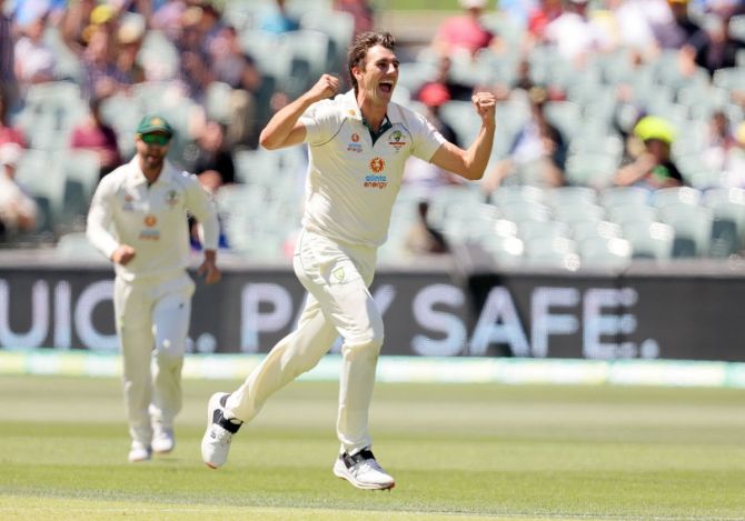 Australia pacer Pat Cummins celebrates after dismissing India captain Virat Kohli in the second innings on Day 3 of the first Test, at the Adelaide Oval
