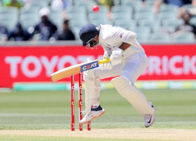 Mayank Agarwal tries to evade a bouncer during the 2nd innings on Day 3 of the first Test at Adelaide Oval in Adelaide on Saturday