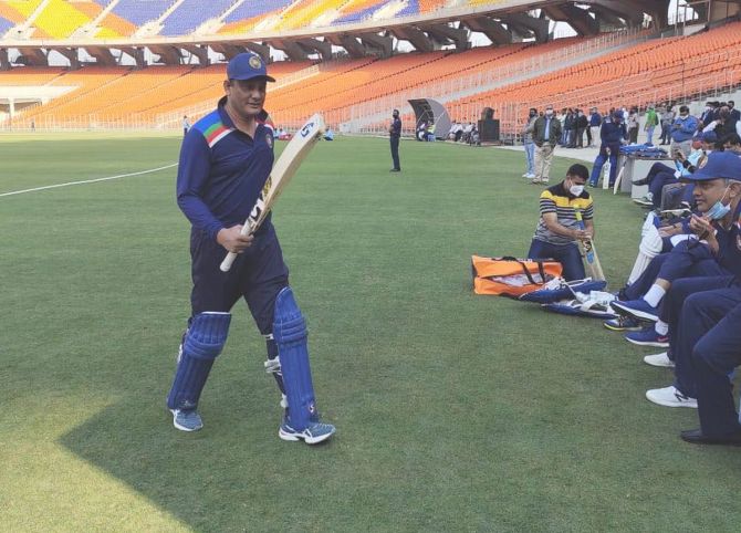 Azharuddin walks back after scoring a quickfire 37 off 22 deliveries for Secretary XI