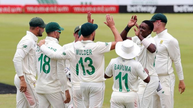 South Africa's Lutho Sipamla celebrates with teammates after taking a Sri Lankan wicket during the first Test in Pretoria on Tuesday