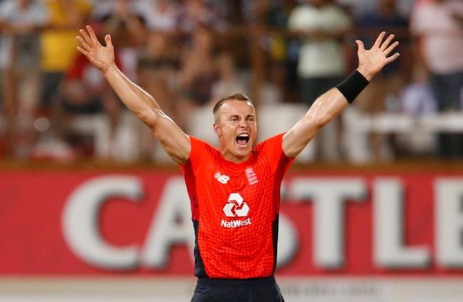 England's Tom Curran celebrates taking the wicket of South Africa's Dwaine Pretorius